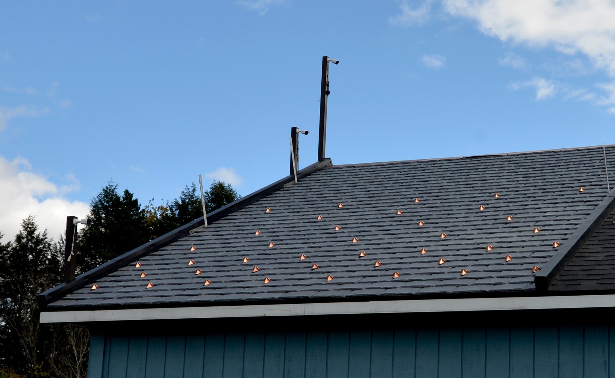 Alpine SnowGuards snow retention product testing in Morrisville, Vermont. Custom snow guard layout for synthetic slate and shingle roofing.